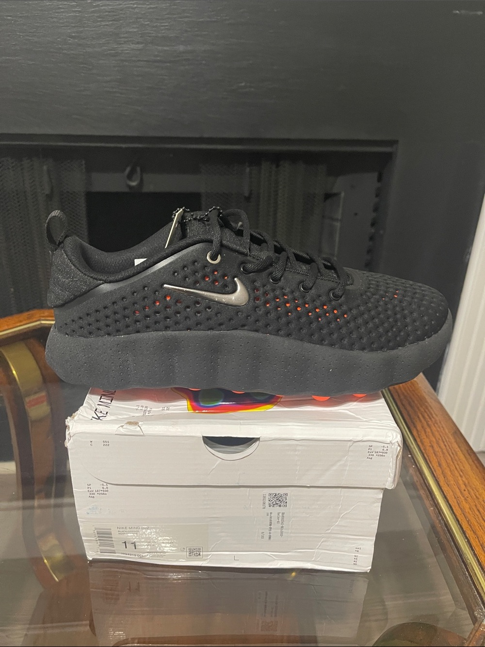 Nike Black sneaker with subtle orange accents